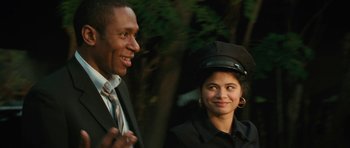 Movie still from “Be Kind Rewind” (2008), directed by Michel Gondry – A man and a woman wearing suits and hats; Close Up shot, Over the shoulder angle