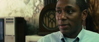 Movie still from “Be Kind Rewind” (2008), directed by Michel Gondry – A person wearing a shirt and tie; Close Up shot, Low angle