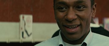 Movie still from “Be Kind Rewind” (2008), directed by Michel Gondry – A man smiling for the camera; Close Up shot, Low angle