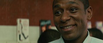 Movie still from “Be Kind Rewind” (2008), directed by Michel Gondry – A man smiling for the camera; Close Up shot, Low angle