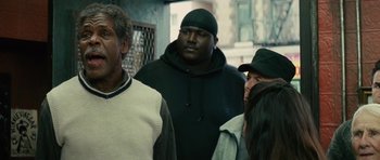 Movie still from “Be Kind Rewind” (2008), directed by Michel Gondry – A group of men standing next to each other; Medium shot, Over the shoulder angle