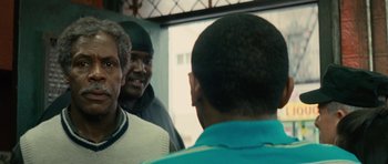 Movie still from “Be Kind Rewind” (2008), directed by Michel Gondry – A group of men standing next to each other in front of a window; Close Up shot, Over the shoulder angle