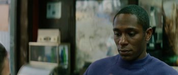 Movie still from “Be Kind Rewind” (2008), directed by Michel Gondry – A person wearing a purple shirt; Close Up shot, Over the shoulder angle