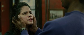 Movie still from “Be Kind Rewind” (2008), directed by Michel Gondry – A woman sitting in front of a man holding her head; Close Up shot, Over the shoulder angle