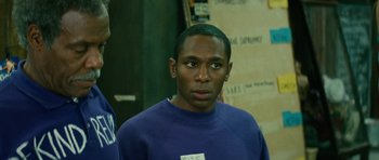 Movie still from “Be Kind Rewind” (2008), directed by Michel Gondry – A man with a blue shirt is standing in a room; Close Up shot, Over the shoulder angle