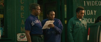 Movie still from “Be Kind Rewind” (2008), directed by Michel Gondry – Two men standing next to each other holding papers; Medium shot, Over the shoulder angle