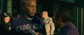 Movie still from “Be Kind Rewind” (2008), directed by Michel Gondry – Two men talking to each other in front of a crowd; Close Up shot, Over the shoulder angle