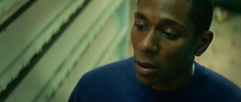 Movie still from “Be Kind Rewind” (2008), directed by Michel Gondry – A person wearing a blue shirt; Close Up shot, Overhead angle