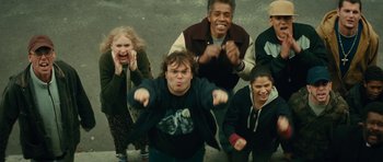 Movie still from “Be Kind Rewind” (2008), directed by Michel Gondry – A group of people standing next to each other on the street; Medium shot, High angle