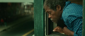 Movie still from “Be Kind Rewind” (2008), directed by Michel Gondry – A man leaning on a window sill looking out of a window; Close Up shot, Low angle