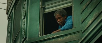 Movie still from “Be Kind Rewind” (2008), directed by Michel Gondry – An older man looking out of a window; Close Up shot, Low angle