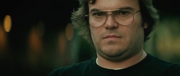 Movie still from “Be Kind Rewind” (2008), directed by Michel Gondry – A person wearing glasses; Close Up shot, Low angle