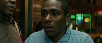 Movie still from “Be Kind Rewind” (2008), directed by Michel Gondry – A person wearing a blue shirt; Close Up shot, Low angle