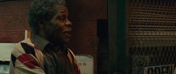 Movie still from “Be Kind Rewind” (2008), directed by Michel Gondry – An older man standing next to a brick wall; Close Up shot, Low angle