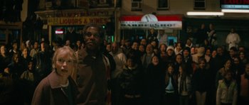 Movie still from “Be Kind Rewind” (2008), directed by Michel Gondry – A large group of people standing in front of a building; Medium shot, Low angle