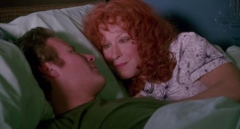 Movie still from “Beaches” (1988), directed by Garry Marshall – A man and a woman laying in a bed together; Close Up shot, Overhead angle