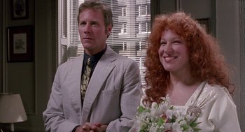 Movie still from “Beaches” (1988), directed by Garry Marshall – A man and a woman sitting next to each other; Close Up shot, Over the shoulder angle