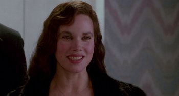 Movie still from “Beaches” (1988), directed by Garry Marshall – A person smiling for the camera; Close Up shot, Over the shoulder angle