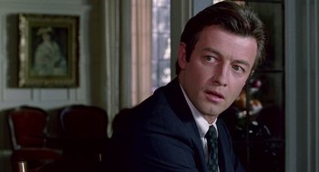 Movie still from “Beaches” (1988), directed by Garry Marshall – A person wearing a suit and tie; Close Up shot, Over the shoulder angle