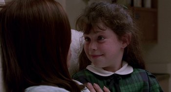 Movie still from “Beaches” (1988), directed by Garry Marshall – A young girl looking at her reflection in a mirror; Close Up shot, Over the shoulder angle