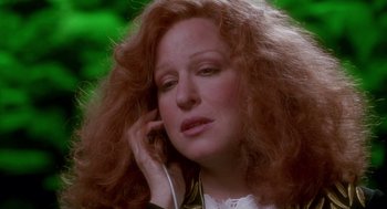 Movie still from “Beaches” (1988), directed by Garry Marshall – A person talking on a cell phone; Close Up shot, High angle