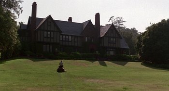 Movie still from “Beaches” (1988), directed by Garry Marshall – A house with a large lawn in front of it; Extreme Wide shot, Low angle