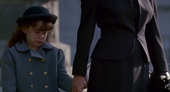 Movie still from “Beaches” (1988), directed by Garry Marshall – A woman holding a child's hand while standing next to a man; Close Up shot, Over the shoulder angle