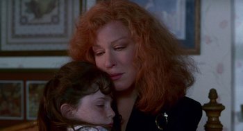 Movie still from “Beaches” (1988), directed by Garry Marshall – A person and a child; Close Up shot, High angle