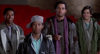 Movie still from “Beat Street” (1984), directed by Stan Lathan – Two young men standing next to each other; Medium shot, Low angle