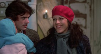 Movie still from “Beat Street” (1984), directed by Stan Lathan – A woman in a red hat and a man in a blue scarf; Close Up shot, Over the shoulder angle