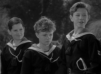 Movie still from “Beau Geste” (1939), directed by William A. Wellman – A group of young men standing next to each other; Medium shot, High angle
