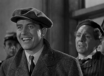 Movie still from “Beau Geste” (1939), directed by William A. Wellman – A black and white photo of a man wearing a hat; Close Up shot, Low angle