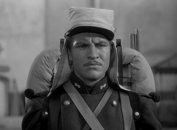 Movie still from “Beau Geste” (1939), directed by William A. Wellman – A man in a military uniform with a hat on; Close Up shot, Low angle