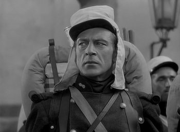 Movie still from “Beau Geste” (1939), directed by William A. Wellman – A man wearing a hat and a uniform; Close Up shot, High angle
