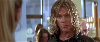 Movie still from “Beauty Shop” (2005), directed by Bille Woodruff – A person with long blonde hair; Close Up shot, Over the shoulder angle