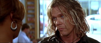 Movie still from “Beauty Shop” (2005), directed by Bille Woodruff – A person wearing a leather jacket; Close Up shot, Over the shoulder angle