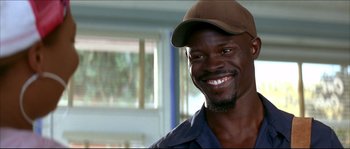 Movie still from “Beauty Shop” (2005), directed by Bille Woodruff – A person wearing a hat; Close Up shot, Low angle