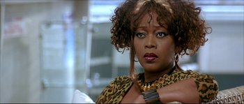Movie still from “Beauty Shop” (2005), directed by Bille Woodruff – A person wearing a leopard print jacket; Close Up shot, Low angle
