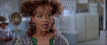 Movie still from “Beauty Shop” (2005), directed by Bille Woodruff – A person wearing a green shirt; Close Up shot, Low angle
