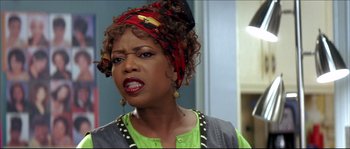 Movie still from “Beauty Shop” (2005), directed by Bille Woodruff – A person wearing a headscarf; Close Up shot, Over the shoulder angle