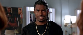 Movie still from “Beauty Shop” (2005), directed by Bille Woodruff – A person wearing a necklace; Close Up shot, Low angle