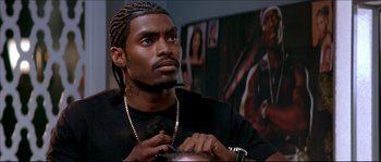 Movie still from “Beauty Shop” (2005), directed by Bille Woodruff – A person with a beard; Close Up shot, Over the shoulder angle