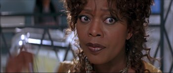 Movie still from “Beauty Shop” (2005), directed by Bille Woodruff – A woman's eyes and face; Close Up shot, Low angle