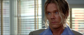 Movie still from “Beauty Shop” (2005), directed by Bille Woodruff – A person with long blonde hair; Close Up shot, Over the shoulder angle