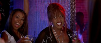 Movie still from “Beauty Shop” (2005), directed by Bille Woodruff – A person with a glass of wine; Close Up shot, High angle