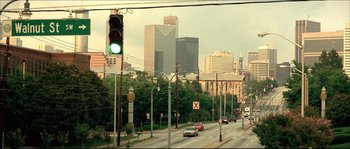 Movie still from “Beauty Shop” (2005), directed by Bille Woodruff – A green traffic light sitting on the side of a road; Extreme Wide shot, High angle