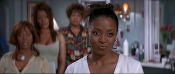 Movie still from “Beauty Shop” (2005), directed by Bille Woodruff – A person wearing a white shirt; Close Up shot, Over the shoulder angle