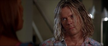 Movie still from “Beauty Shop” (2005), directed by Bille Woodruff – A person with long blonde hair; Close Up shot, Over the shoulder angle