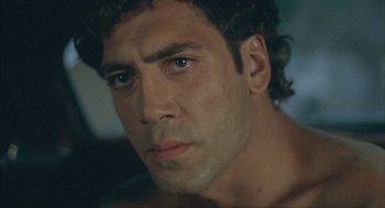 Movie still from “Before Night Falls” (2000), directed by Julian Schnabel – A person with a beard; Close Up shot, Low angle