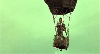 Movie still from “Before Night Falls” (2000), directed by Julian Schnabel – A man is in a hot air balloon; Extreme Wide shot, Low angle